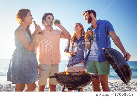 Happy friends doing barbecue and drinking beer 17008018