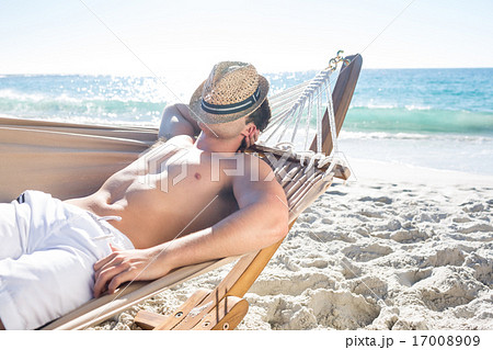Handsome man resting in the hammock Handsome man resting in the hammock 17008909