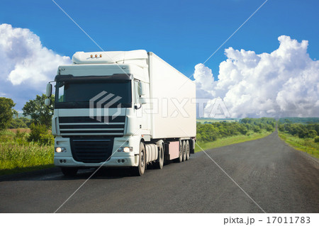 White truck moving on a road White truck moving on a road 17011783