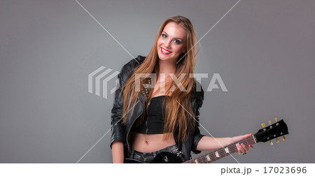 Beautiful girl playing guitar 17023696