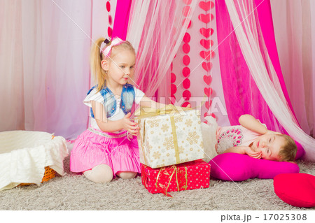 Little girl in a fashionable pink skirt Little girl in a fashionable pink skirt 17025308