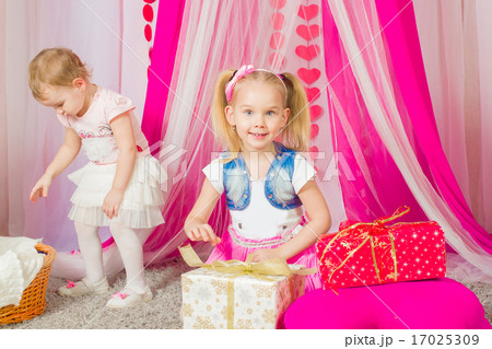 Little girl in a fashionable pink skirt 17025309