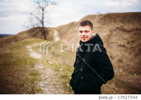 Young Handsome Man Stayed In Field, Meadow In Autumn Day 17027504