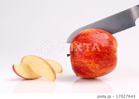 Apple sliced with kitchen knife isolated on white 17027643