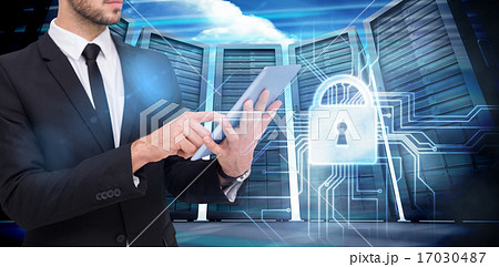 Composite image of mid section of a businessman using digital ta Composite image of mid section of a businessman using digital ta 17030487
