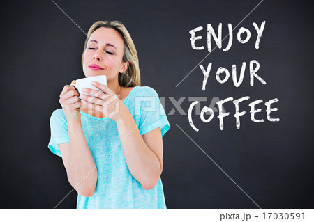 Composite image of peaceful blonde with hot beverage relaxing 17030591