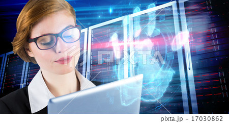Composite image of redhead businesswoman using her tablet pc Composite image of redhead businesswoman using her tablet pc 17030862