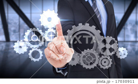 Composite image of mid section of businessman pointing something 17030911