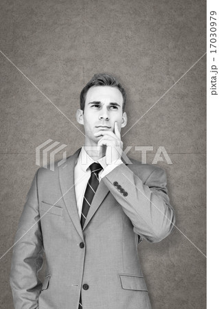Composite image of businessman thinking Composite image of businessman thinking 17030979