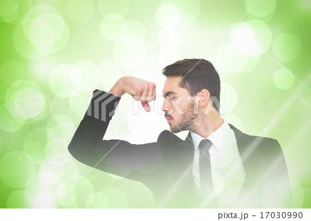 Composite image of cheerful businessman tensing arm muscle Composite image of cheerful businessman tensing arm muscle 17030990