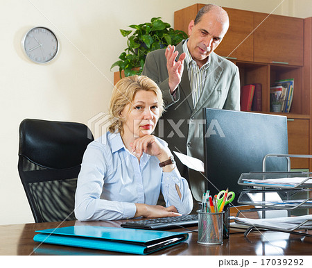 Boss screaming at mature assistant Boss screaming at mature assistant 17039292