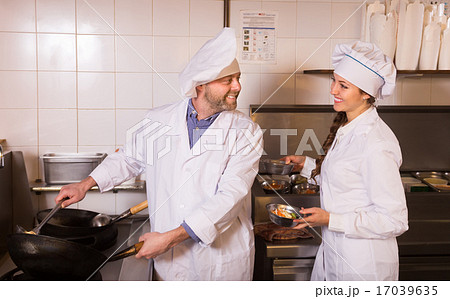 Chef and his helper at bistro kitchen 17039635