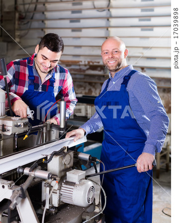 Two workmen in PVC shop Two workmen in PVC shop 17039898