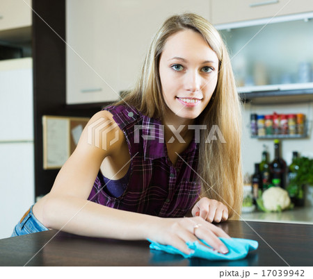 Woman cleaning furniture in kitchen Woman cleaning furniture in kitchen 17039942