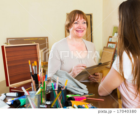 Mature woman paints a portrait 17040380