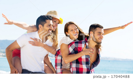 hugging couples on beach hugging couples on beach 17040488