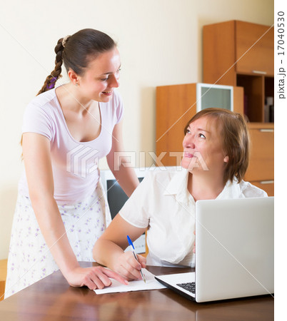 Happy mature woman answer questions 17040530