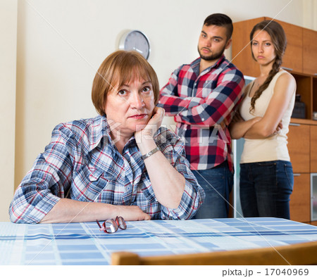 Home conflict at young family with mother 17040969