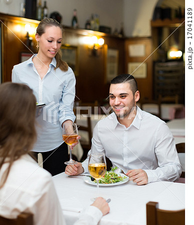waitress with prepared meal at table waitress with prepared meal at table 17041189