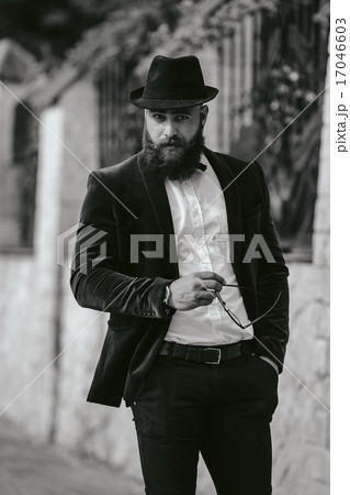 rich man with a beard, thinking about business 17046603