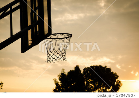 silhouette of a basketball hoop, under the sunset. silhouette of a basketball hoop, under the sunset. 17047907