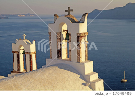Bell tower above the beautiful blue sea, Oia 17049409