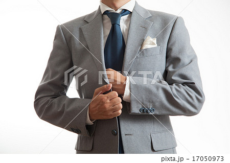 胸ポケットに手を入れるビジネスマンの写真素材