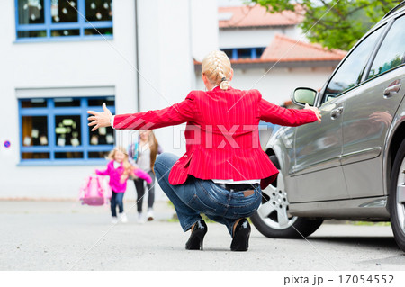 Mother hugging child after bringing her to school Mother hugging child after bringing her to school 17054552