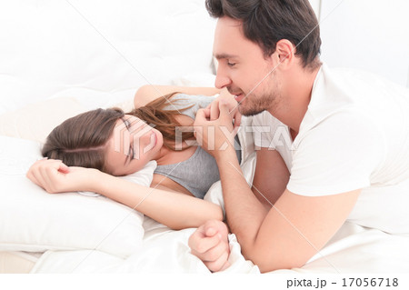 Beautiful couple lying in bed Beautiful couple lying in bed 17056718