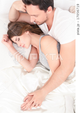 Beautiful couple lying in bed Beautiful couple lying in bed 17056719