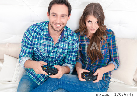 Pleasant couple playing video games  17056745