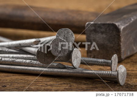 Vintage hammer with nails on wood background 17071738
