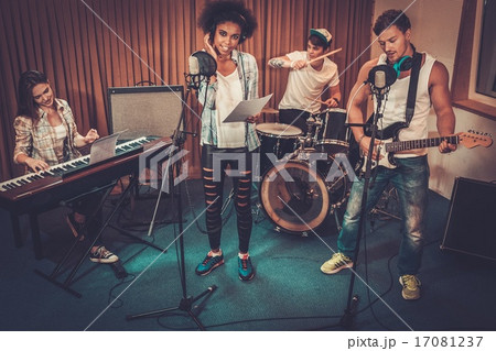 Multiracial music band performing in a recording studio 17081237