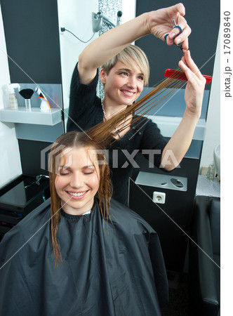 hair stylist working on haircut hair stylist working on haircut 17089840