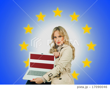 woman holding laptop with latvian flag 17090046