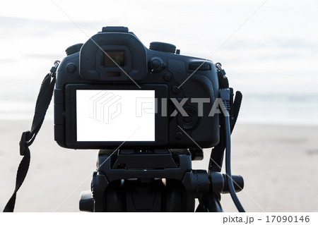 Digital camera on the tripod isolated white screen Digital camera on the tripod isolated white screen 17090146