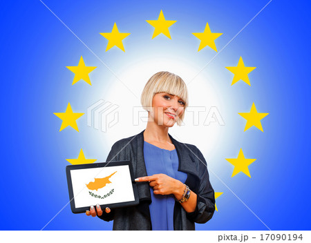woman holding tablet with cyprus flag on european union backgro 17090194