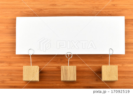One paper note three holders on wood background 17092519