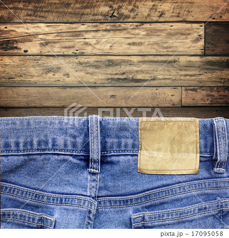 Blue jeans on old wooden surface background 17095058