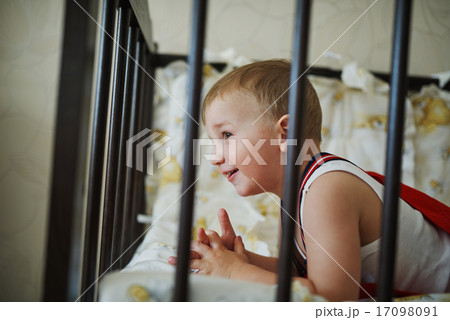 little boy in the cot 17098091