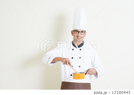 Indian male chef in uniform cooking food 17100445