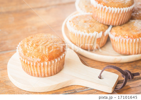 Homemade banana muffins on wooden plate Homemade banana muffins on wooden plate 17101645