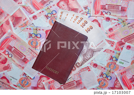 Passport, Thai baht on yuan currency background Passport, Thai baht on yuan currency background 17103007