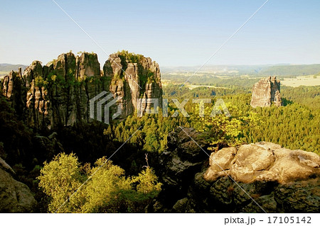 Sharp sandstone cliffs above deep valley. Sharp sandstone cliffs above deep valley. 17105142
