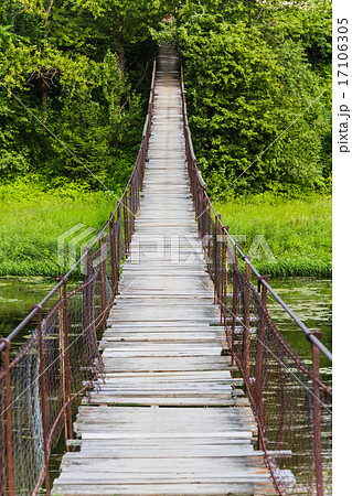 Hanging bridge. Bridge goes over river 17106305