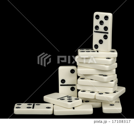 Heap of white dominoes isolated on black Heap of white dominoes isolated on black 17108317