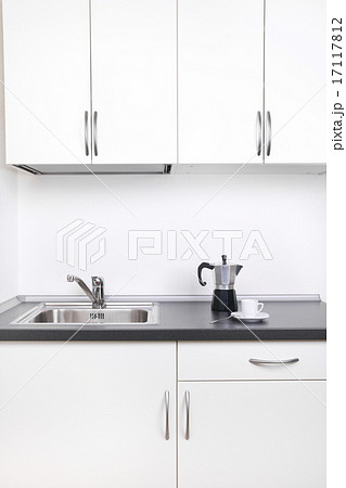 Percolator and cup of coffee on worktop Percolator and cup of coffee on worktop 17117812