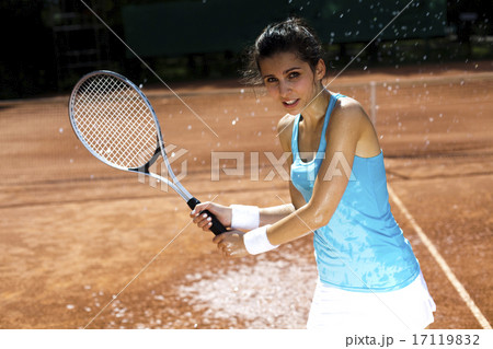 Young woman playing tennis, summertime Young woman playing tennis, summertime 17119832