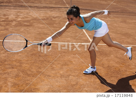 Girl playing tennis on the court Girl playing tennis on the court 17119848