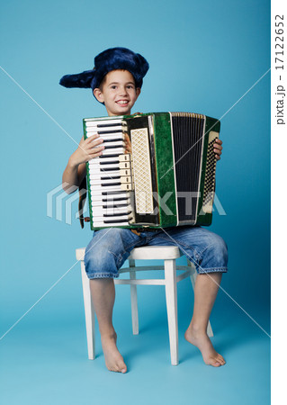 little accordion player on blue background little accordion player on blue background 17122652